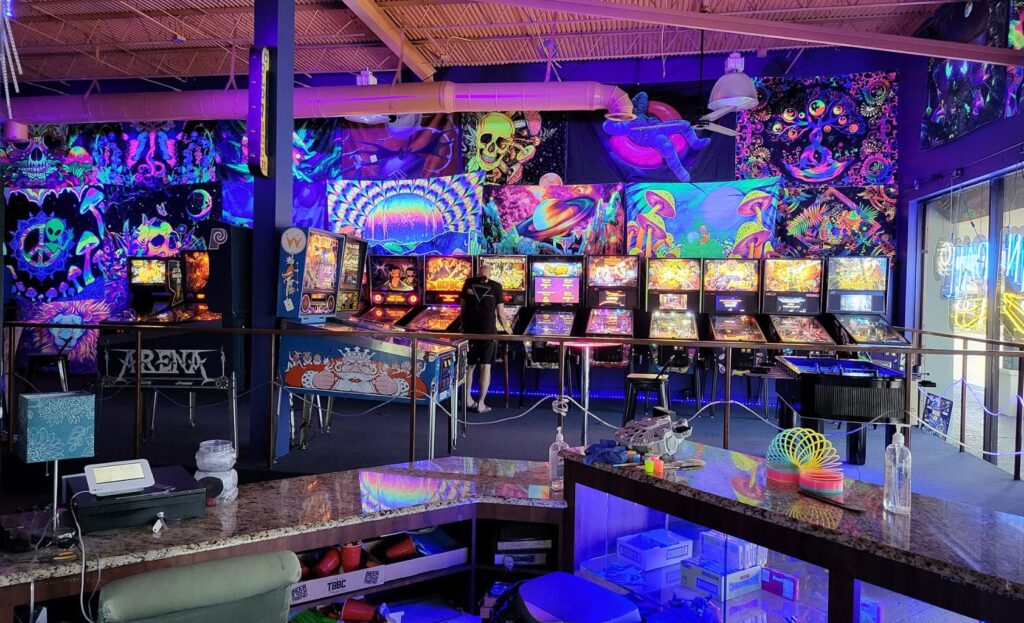 Play Money Pinball Arcade interior featuring games